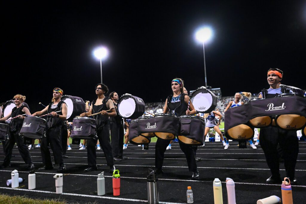 Percussion perform to the fans during the football game