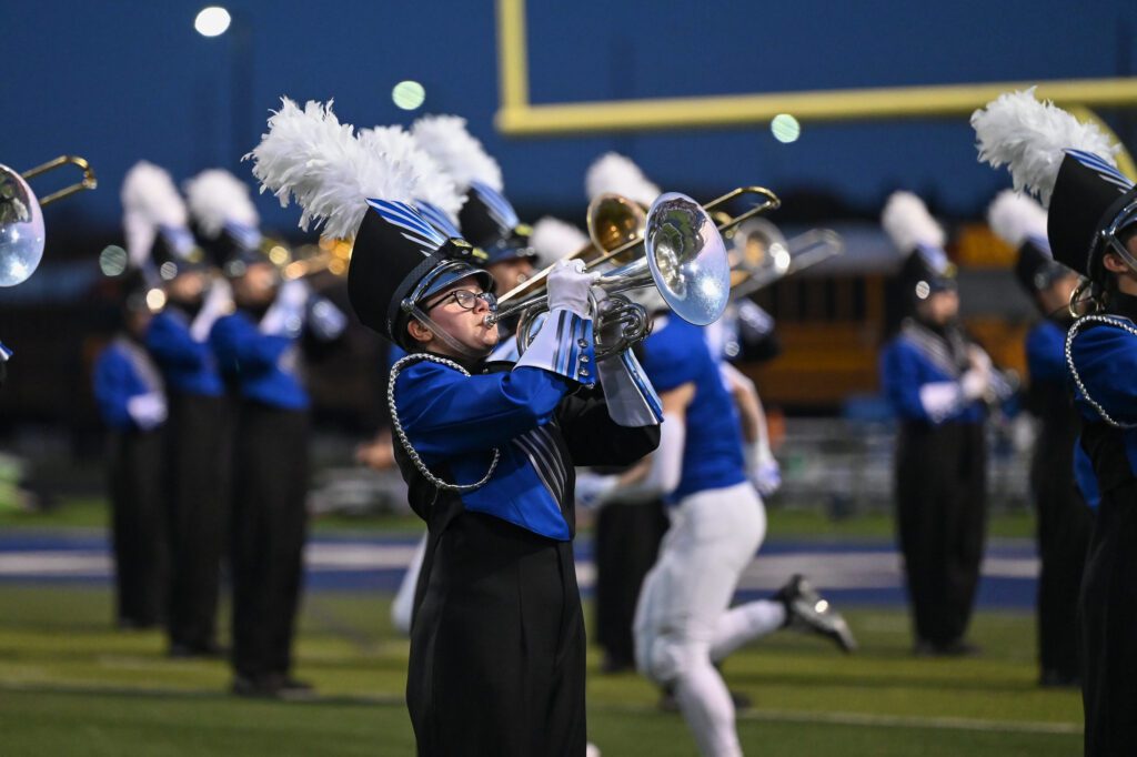Student playing a mellophone during halftime