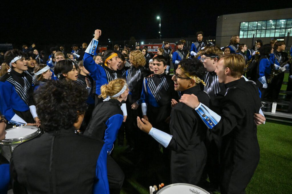 Marching band students cheering