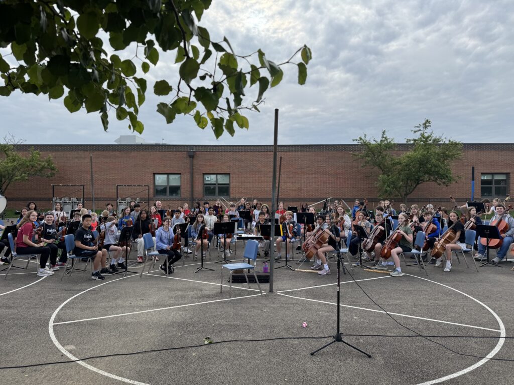 The Tharp Orchestra set up with their instruments for a performance on the Tharp playground