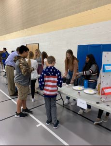 Students in A.P. Psych explain their project to eighth graders from Memorial. Photo by Mrs.Waller.