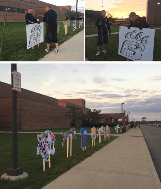 The morning of Homecoming, staff arrived early to install the art along the student entrances.