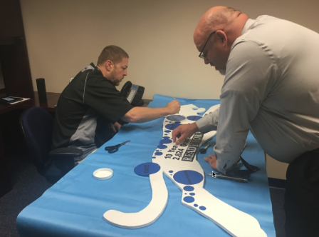 Mr. Starner, left, and Mr. Dellapina, right, helped to create the full Jaguar cut out representing Bradley administrators. 
