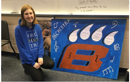 This year, students chose this quote to be their course motto: “Where words fail, music speaks.” Our cutout was designed by several 12th grade Orchestra members, and was coordinated/painted by senior Mia Alford.