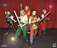The main cast of She Kills Monsters poses for a D&D style photo Photo by Bradley Theater.