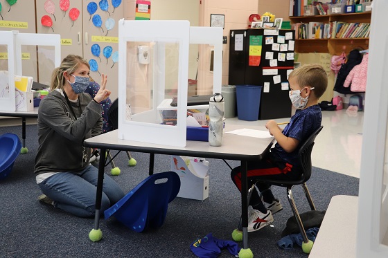kindergarten teacher and student