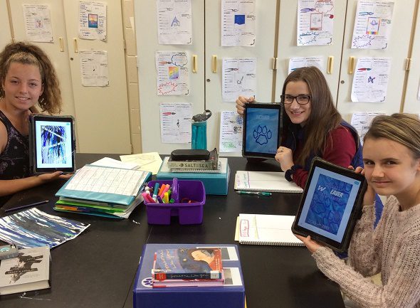 students showing their iPad work