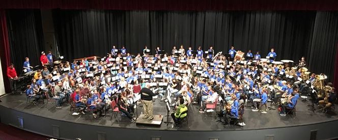 The enite band practicing on stage
