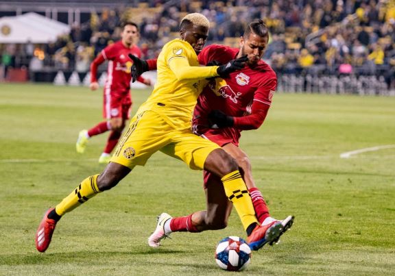 Crew player battling for a ball