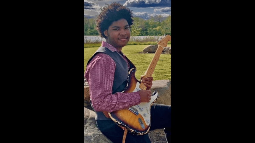 student playing guitar