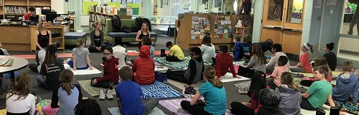 students doing yoga