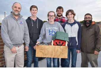 students working on the project on the roof