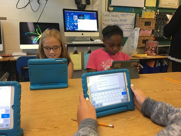students working on ipads