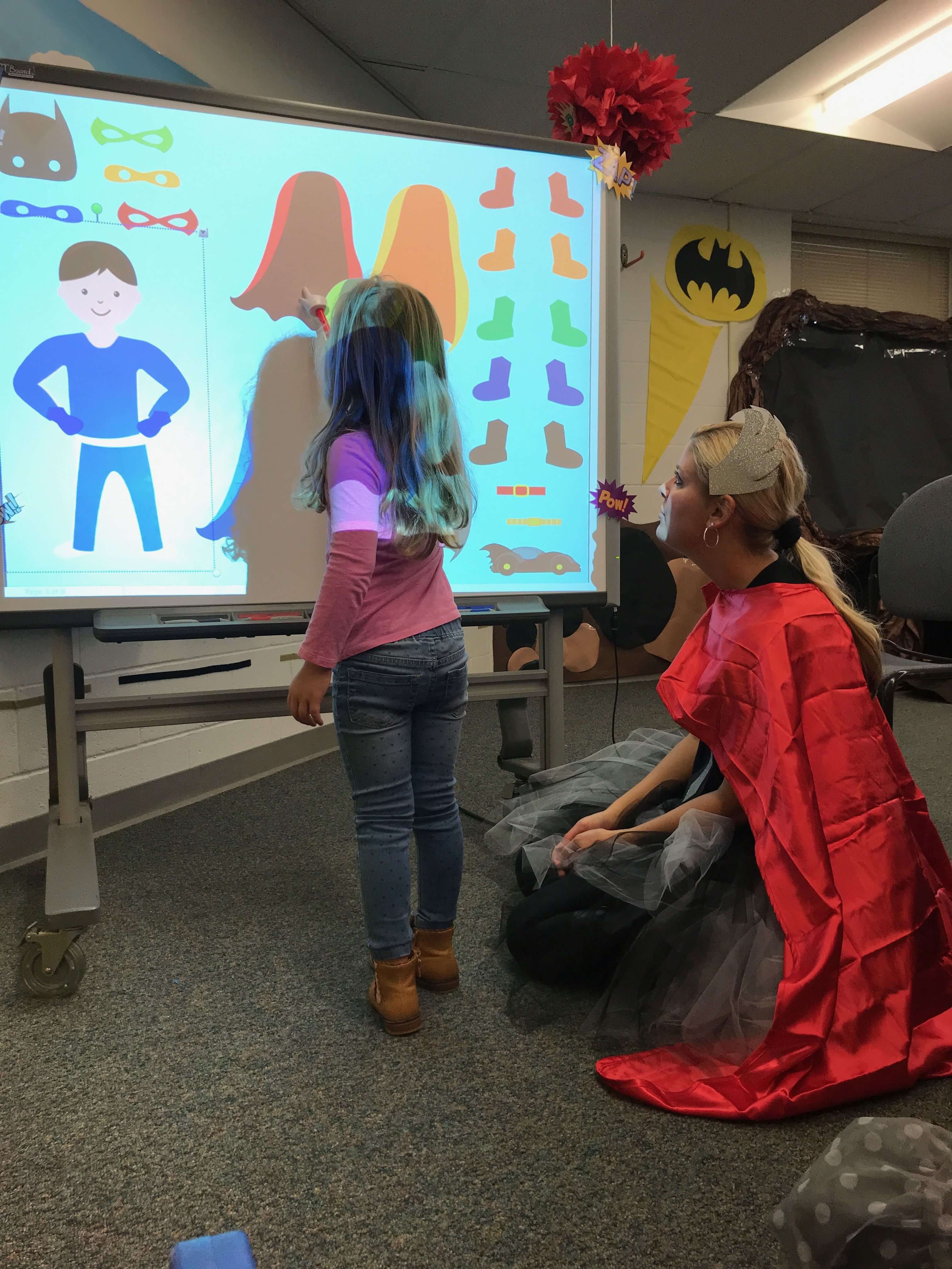 a child working with a super hero teacher