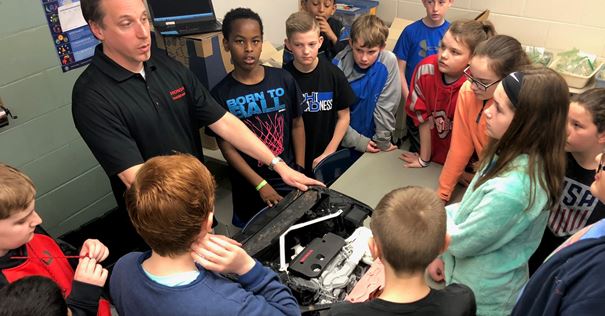 Students work on engine
