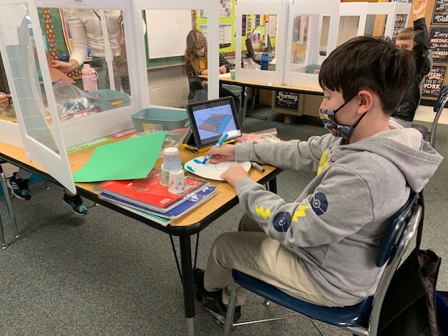 student working on his project
