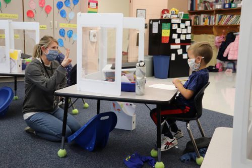 kindergarten teacher and student