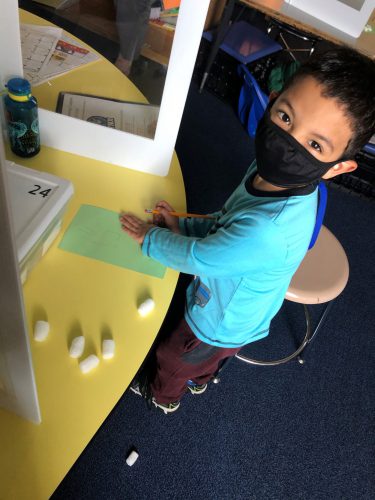 student showing his picture